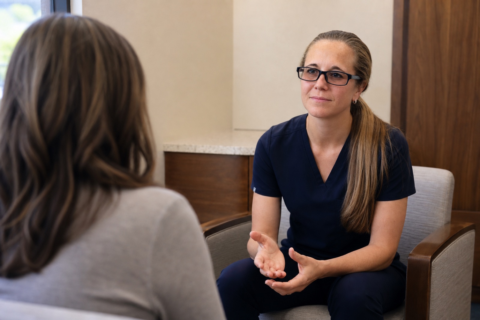Dr. Korves listening to a patient during a consultation
